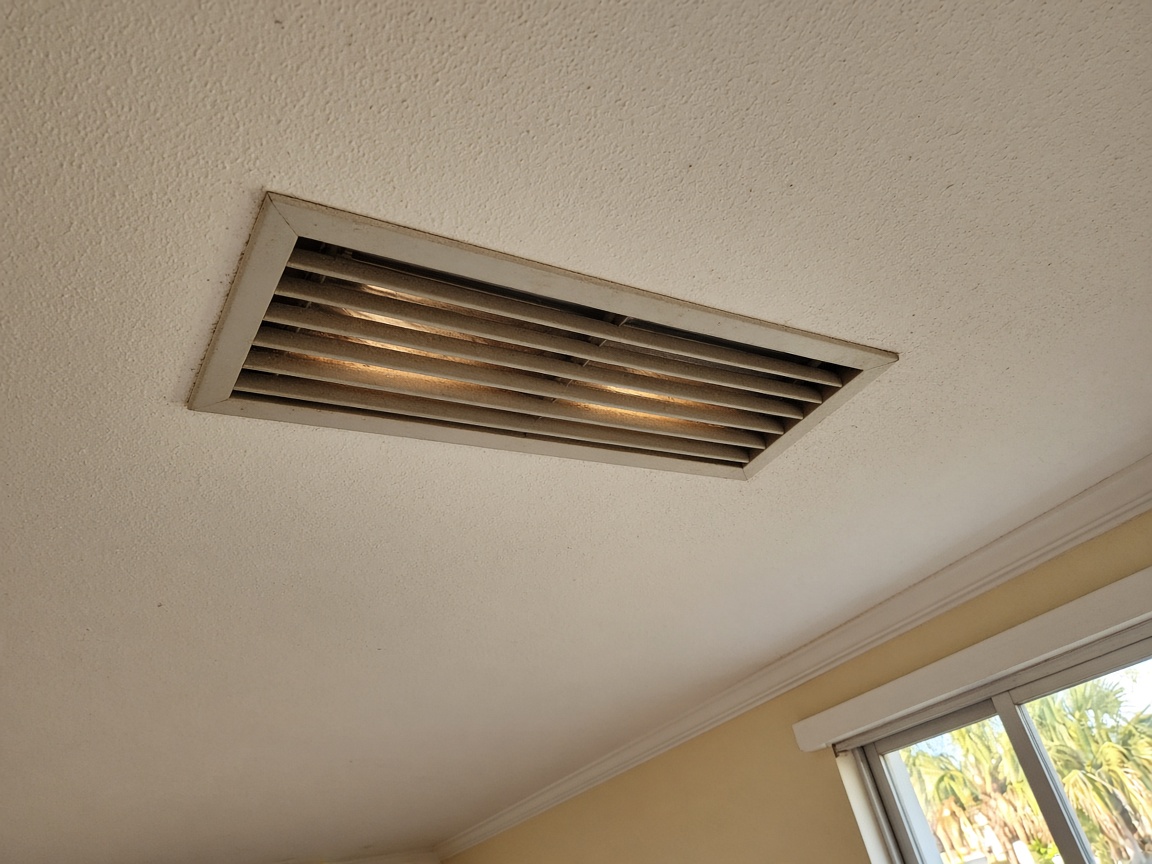 Ceiling vent blowing weak warm air in a Florida living room