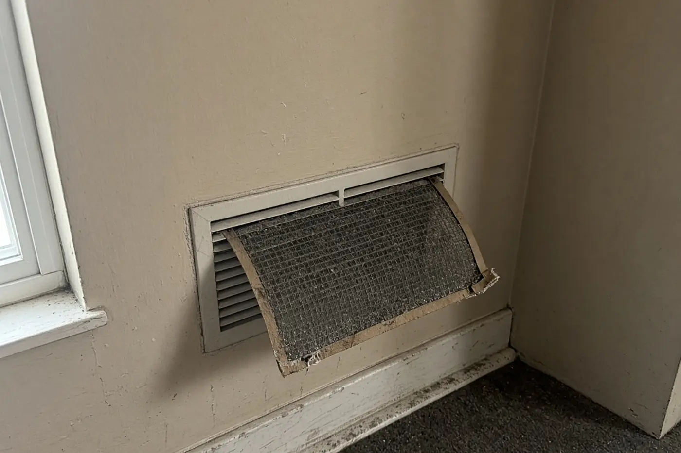 Dust-packed air filter pulled from a return in a Wesley Chapel home